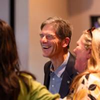 Al Steinman talking with other reception guests